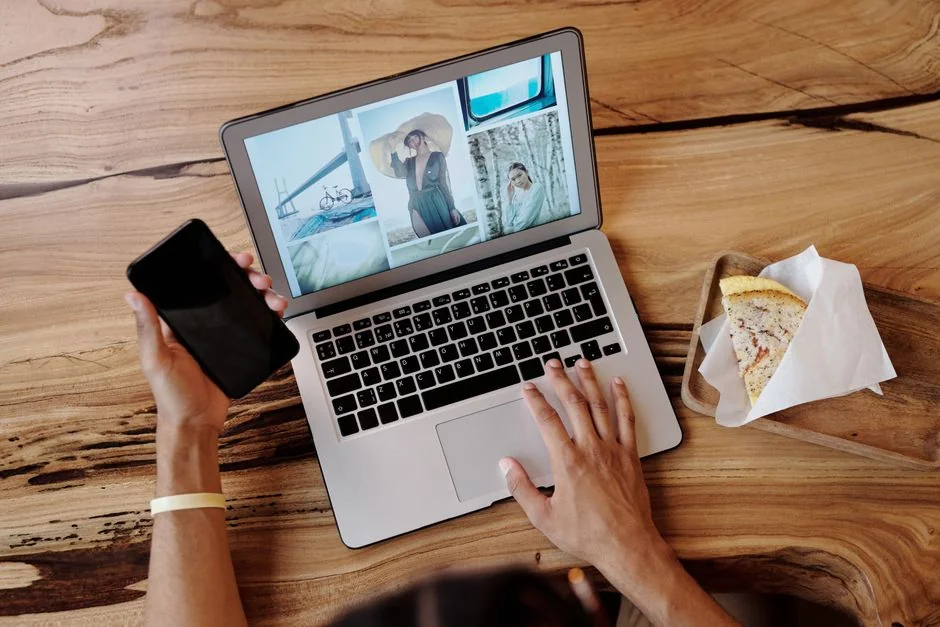 An elevated view of a stylish desk setup with dual monitors, a keyboard, a mouse, and modern accessories.